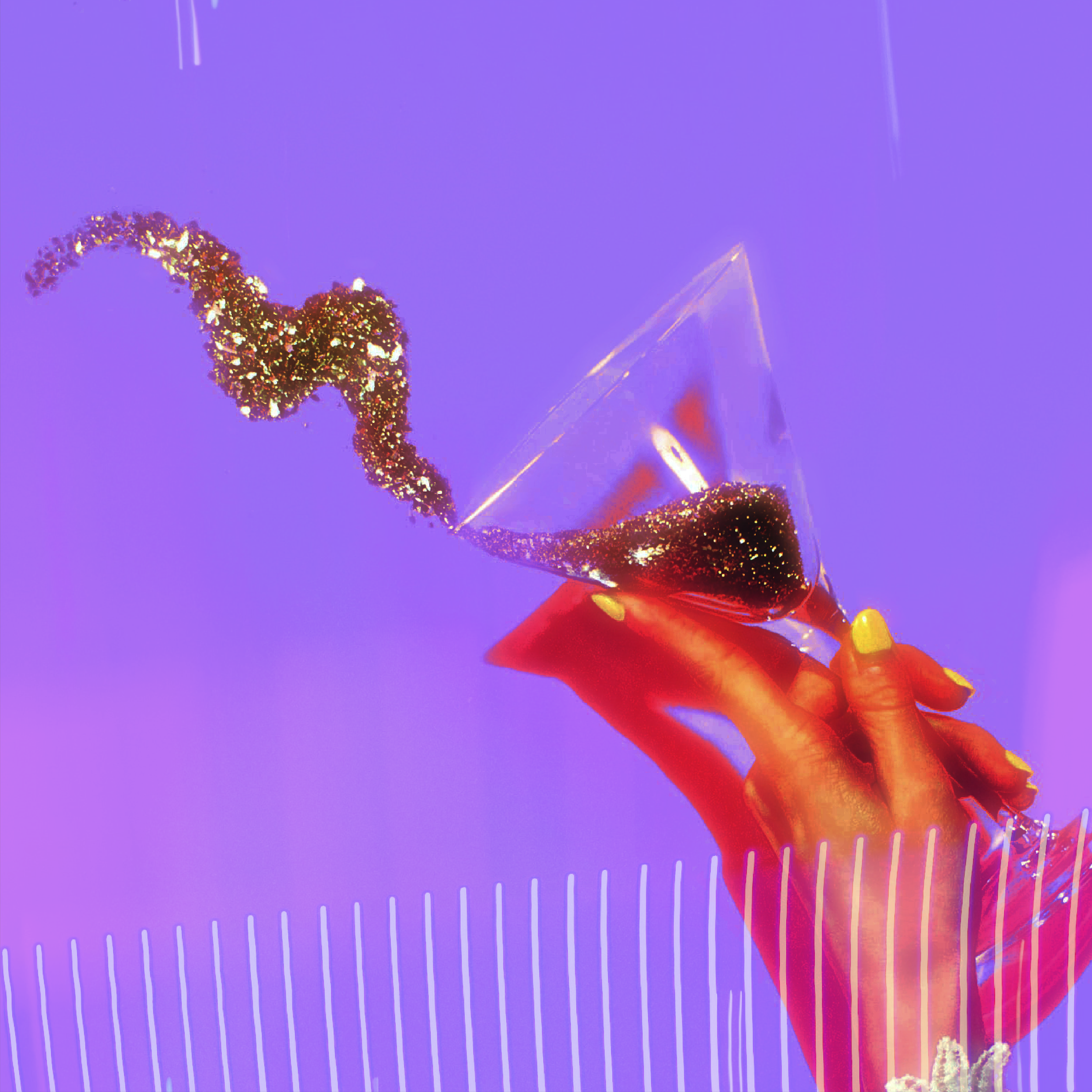 hand tips a martini glass into the air and gold glitter pours out